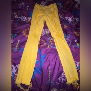 Yellow ripped cotton jeans